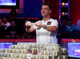 Germany’s Hossein Ensan poses with his bracelet and his $10 million in prize money after winning the 2019 World Series of Poker main event.